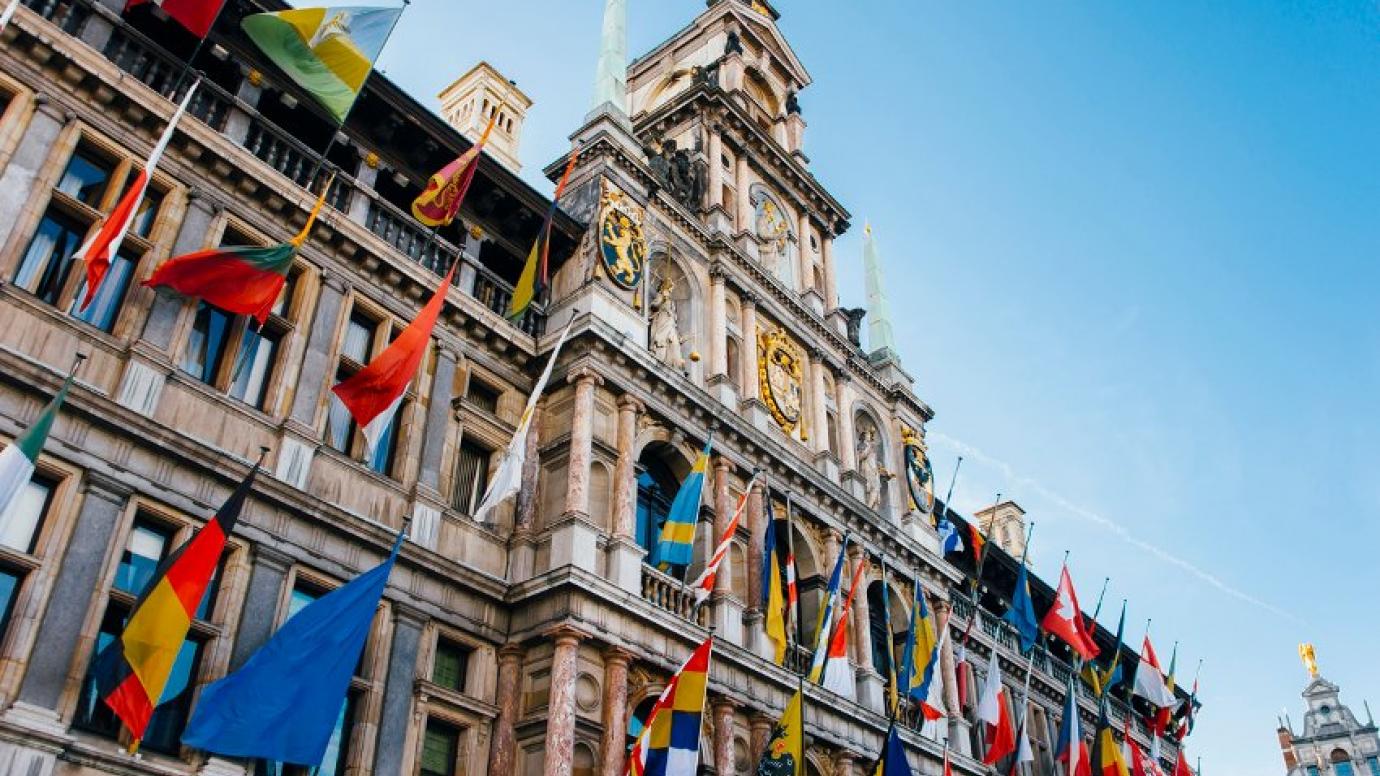 Flags of European Union countries hanging from building